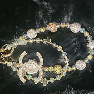 Gold tone Bag Charm, Ab Stone And Gold Beads.